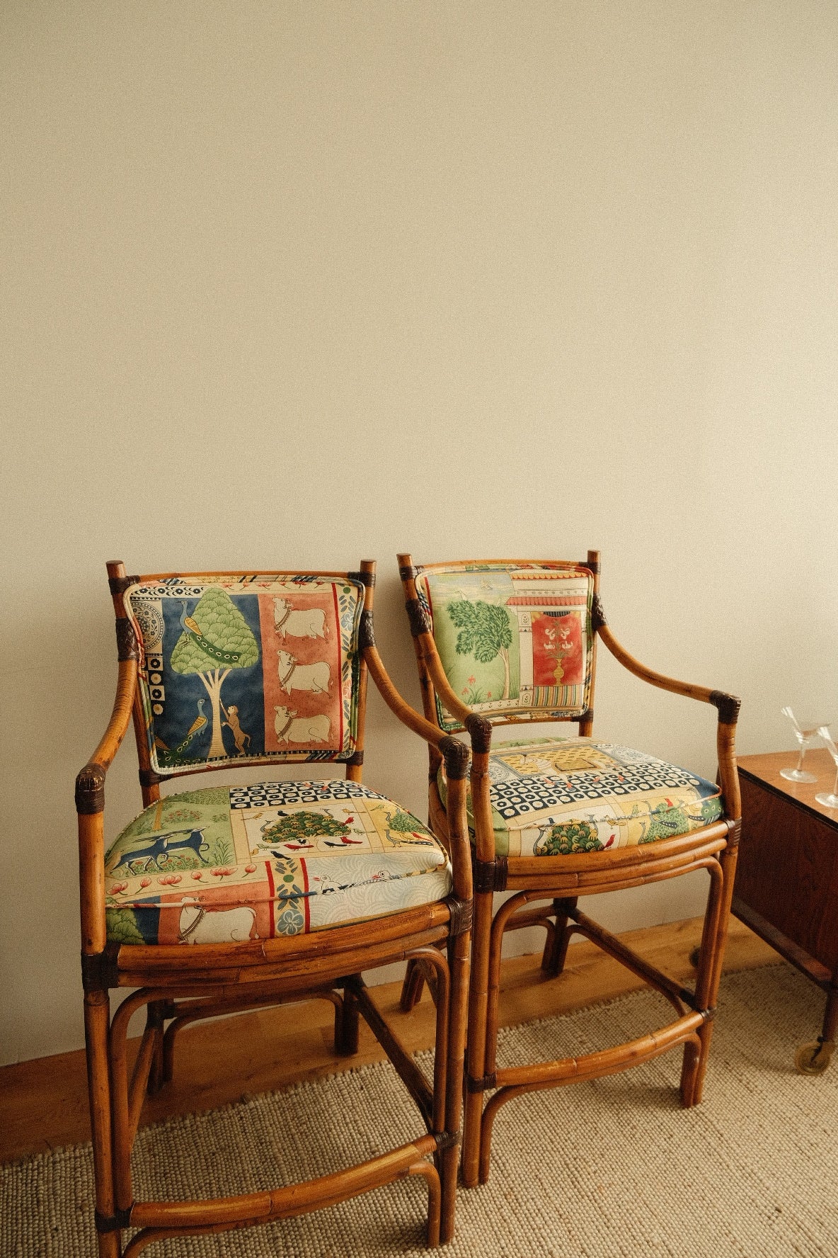 vintage rattan high chairs with folk-print upholstery, pair