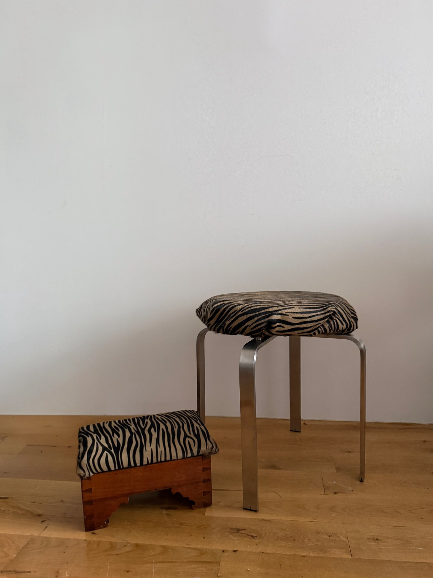 antique dovetailed footstool in custom tiger calf hair