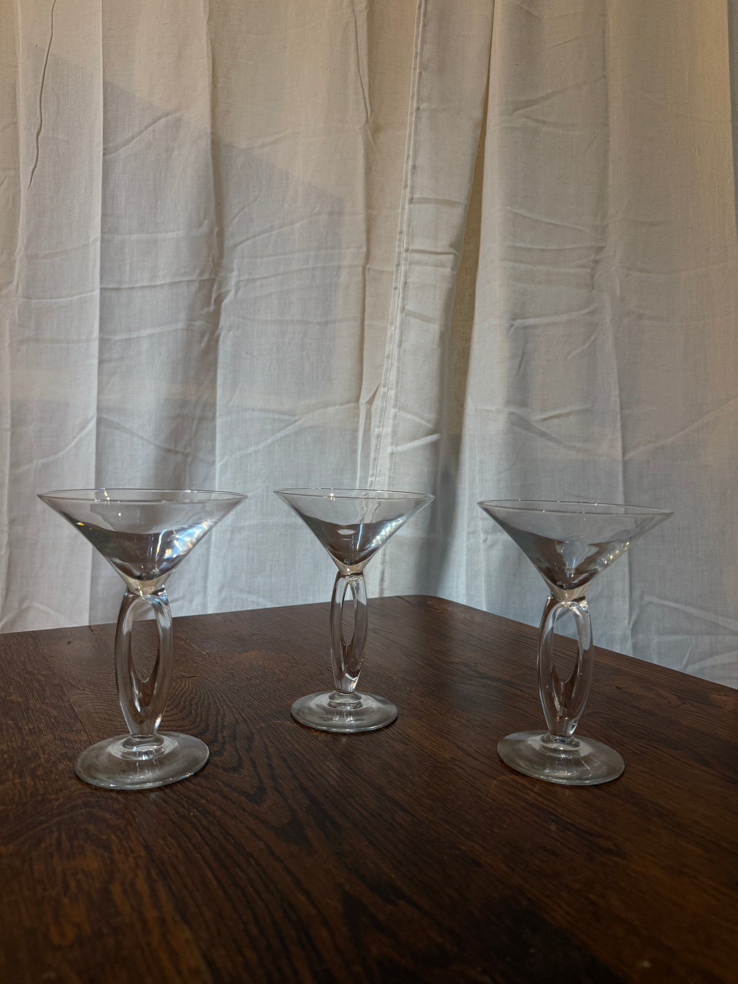 set of three clear modernist martini glasses