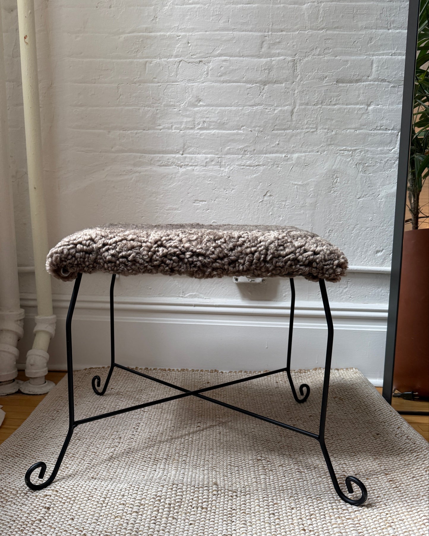 sculptural iron stool in custom mink shearling