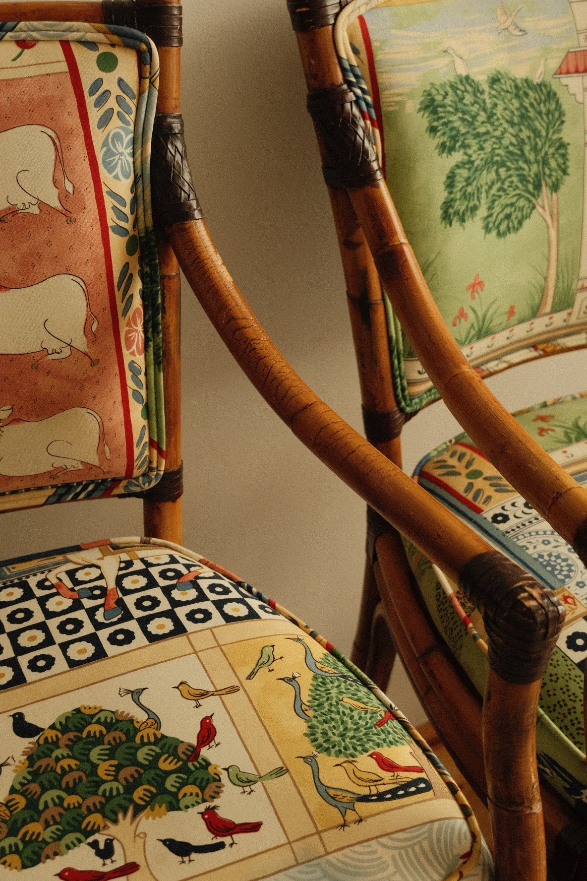 vintage rattan high chairs with folk-print upholstery, pair