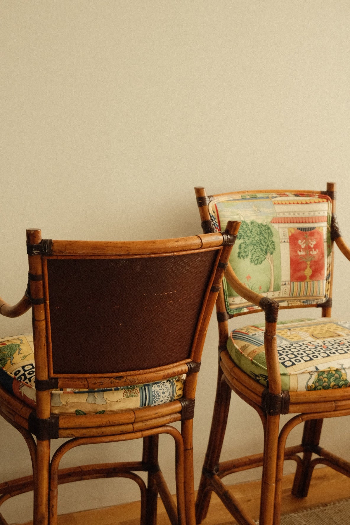 vintage rattan high chairs with folk-print upholstery, pair
