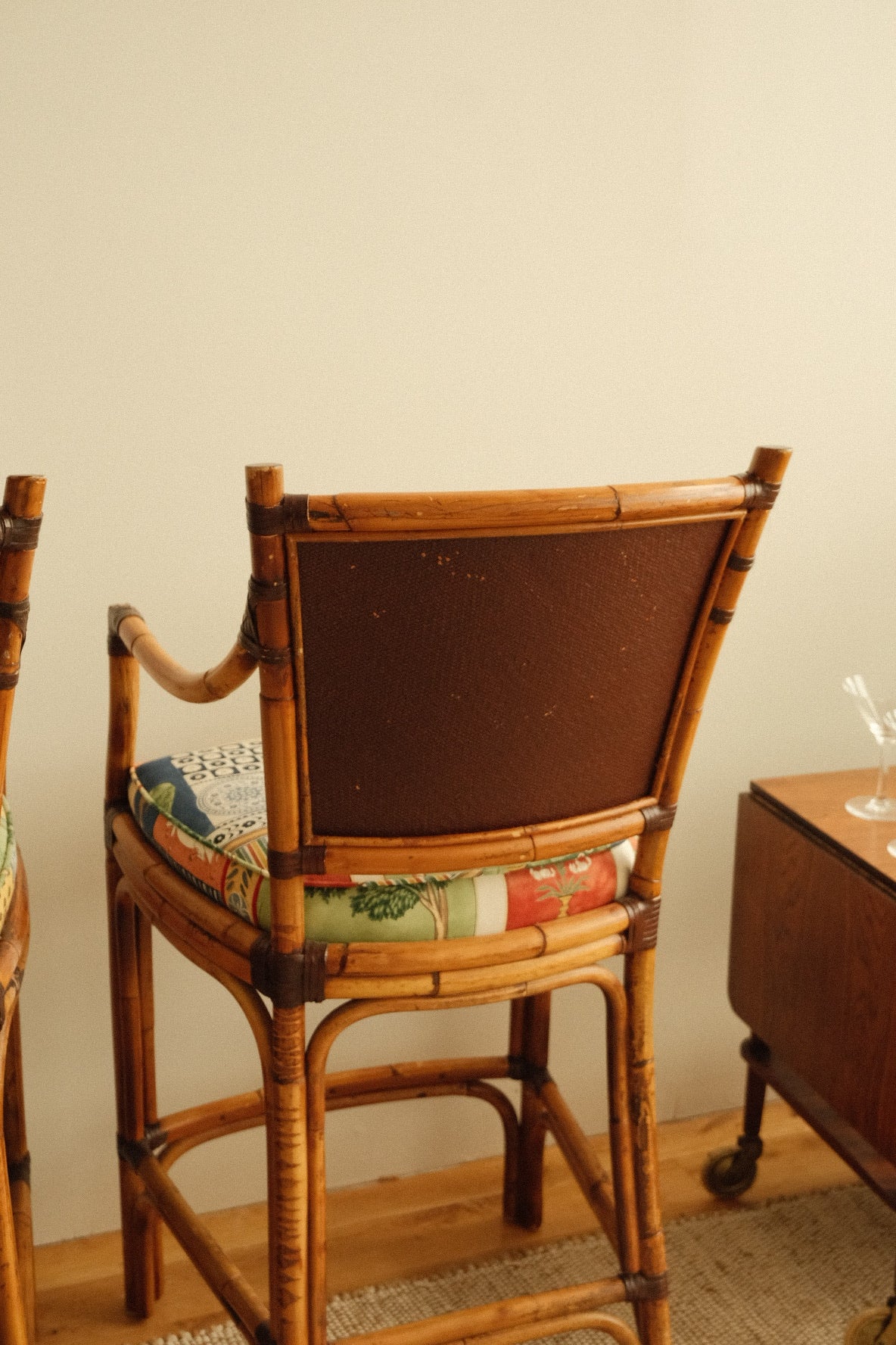 vintage rattan high chairs with folk-print upholstery, pair