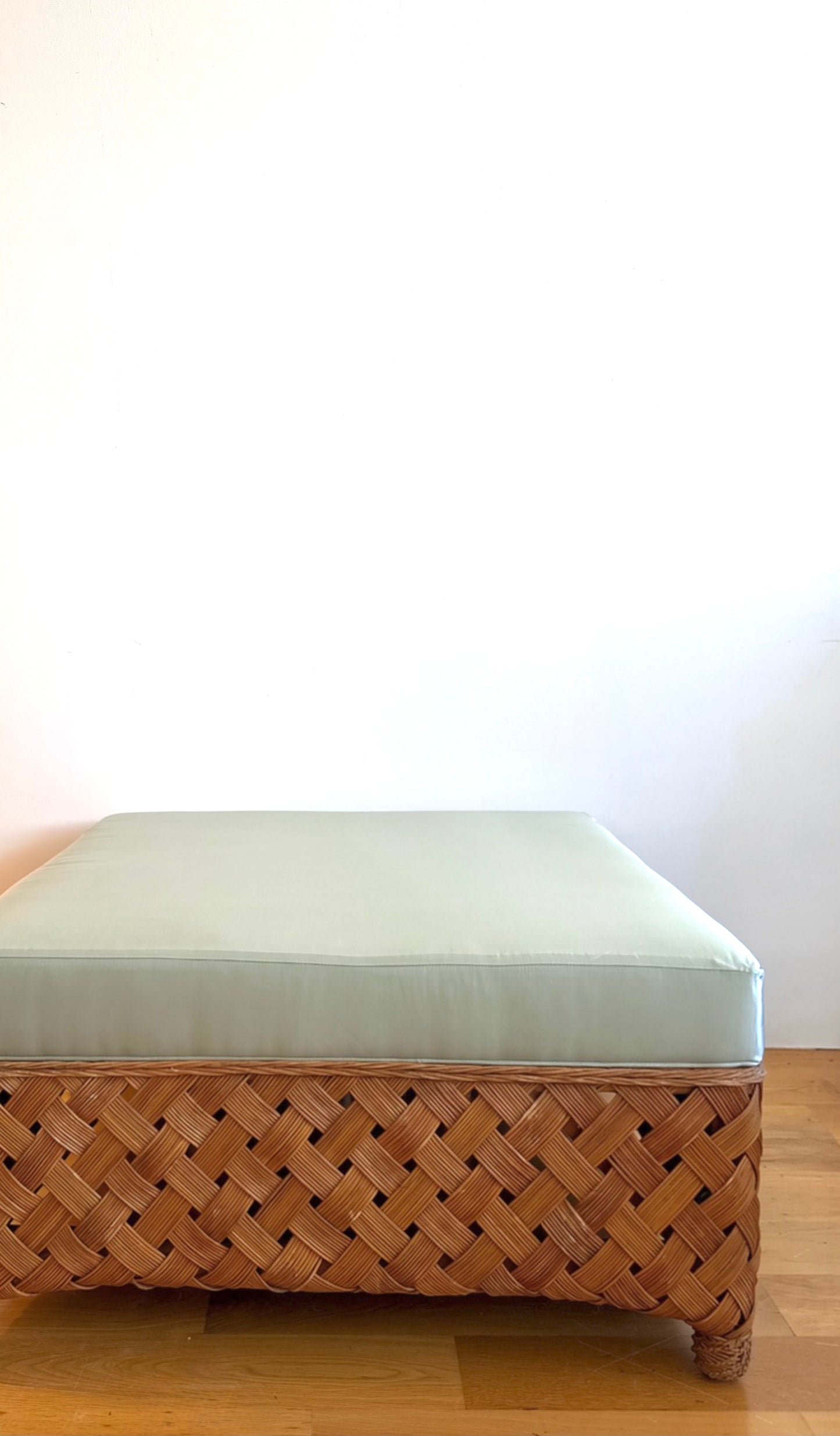 palecek oversized woven rattan ottoman in custom blue silk