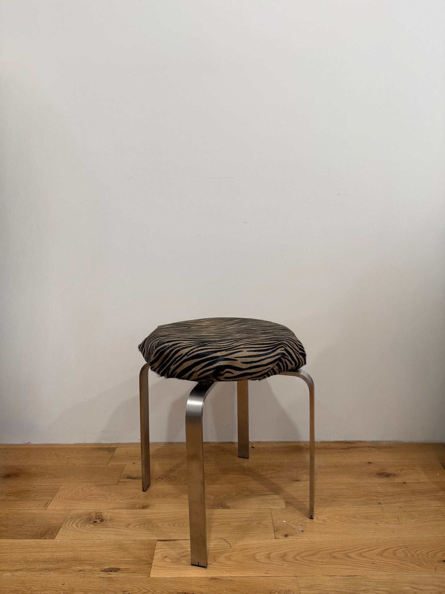 chrome stool in custom tiger calf hair