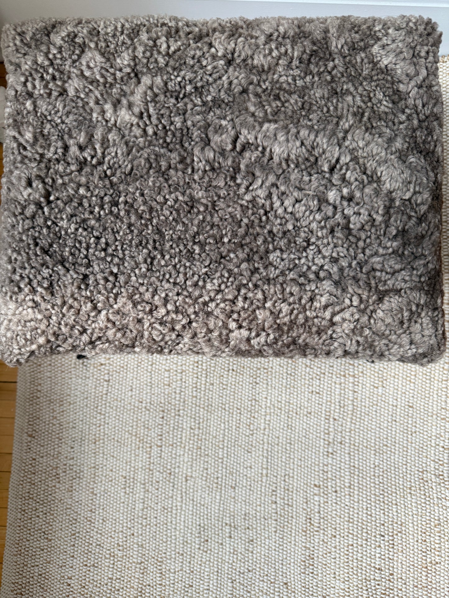 sculptural iron stool in custom mink shearling