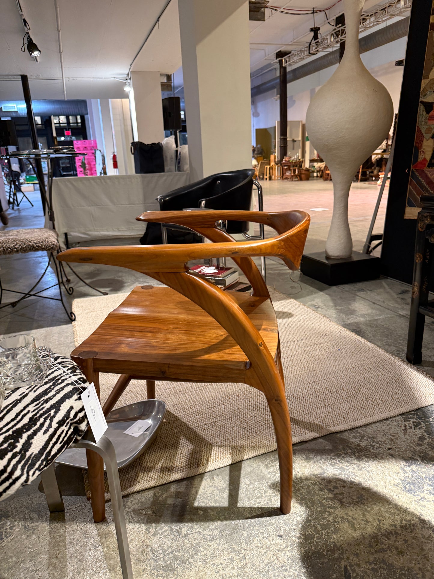 sculptural teak armchair with custom calf hair cushion