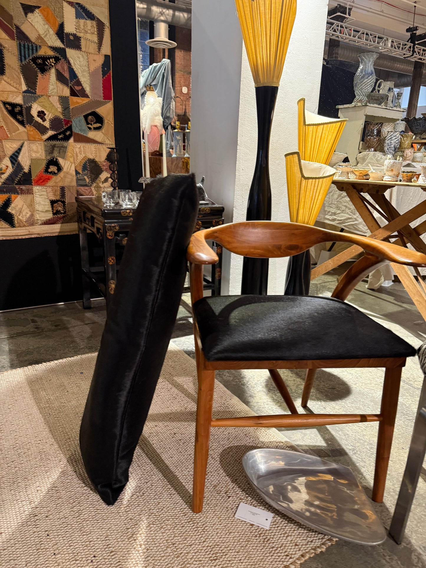 sculptural teak armchair with custom calf hair cushion