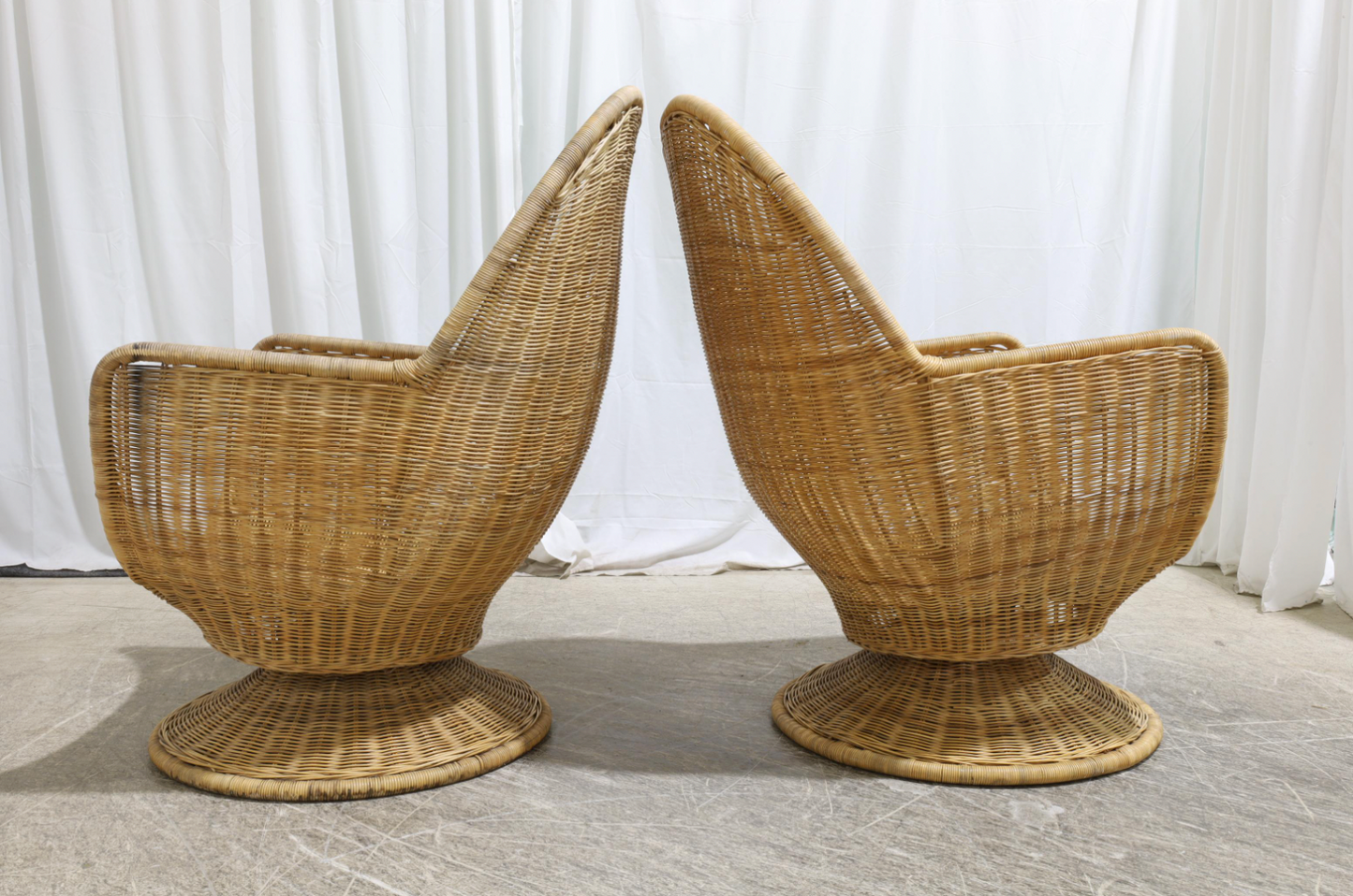 vintage oversized wicker swivel tulip chairs (pair)