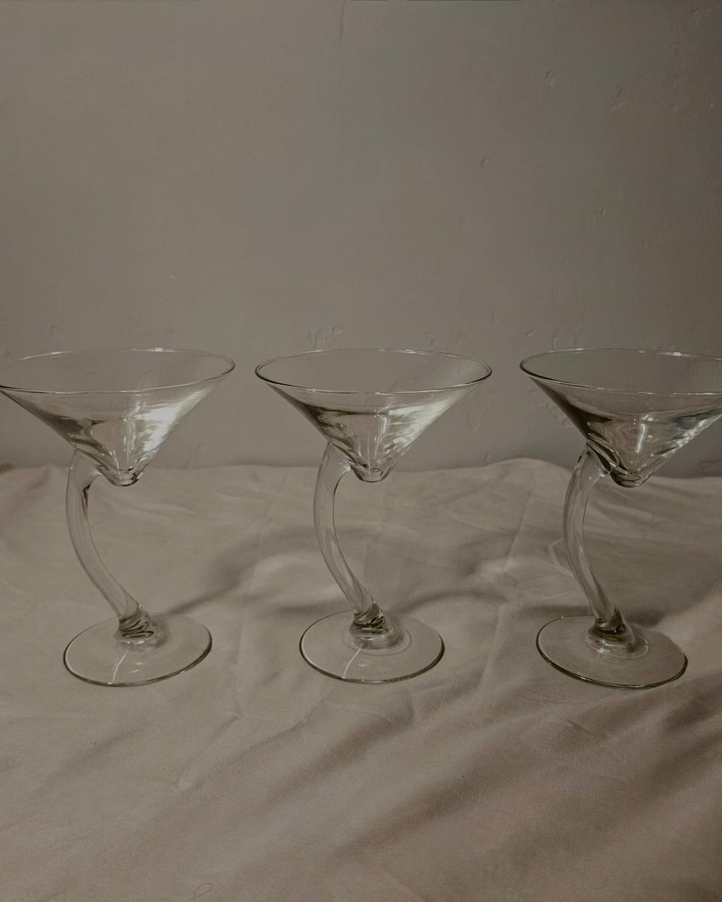set of three libbey “bravura” curved-stem martini glasses