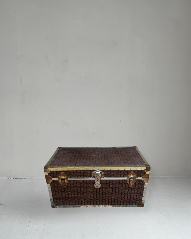 vintage wicker and brass trunk coffee table